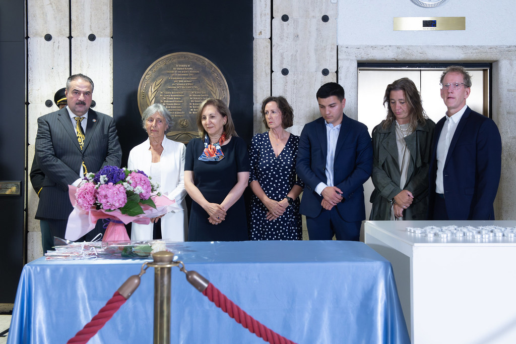 Survivors and families of the victims of the attack against the UN Offices in Baghdad of 19 August 2003 lay flowers during the Commemoration Ceremony of the World Humanitarian Day 2025 in Geneva.